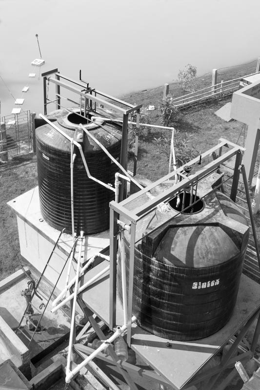 Sulabh Safe Drinking Water project in Arsenic-Affected Areas - The two overhead tanks in which the raw water pumped from the pond is stored and given a pre-treatment primarily to remove turbidity in village Madhusudankati, North 24 parganas district, West Bengal